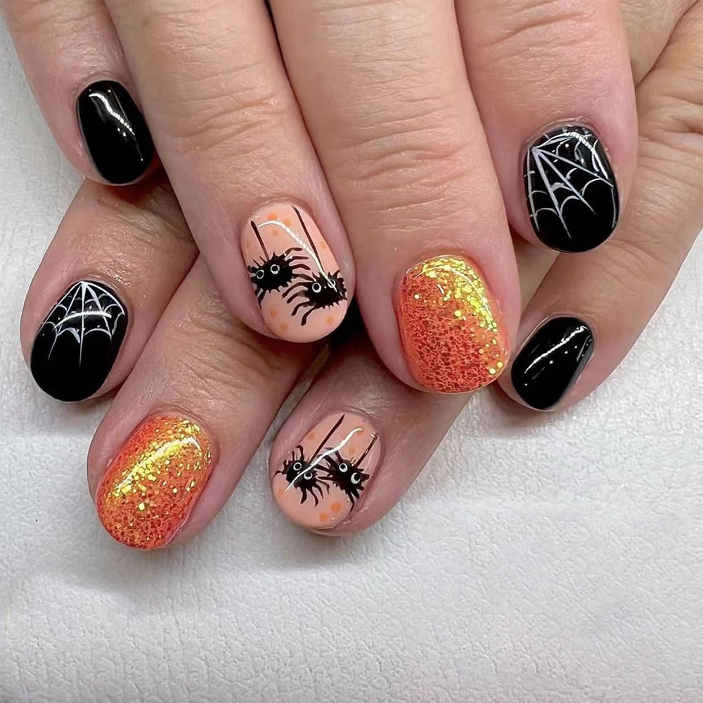 Nail art en poudre dorée avec motif d'araignée fantôme drôle Wear Armor